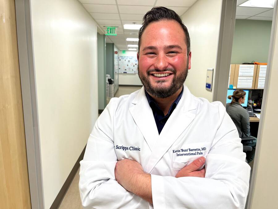 Dr. Kevin Barrette a Pain Management physician, smiling in the clinical setting.