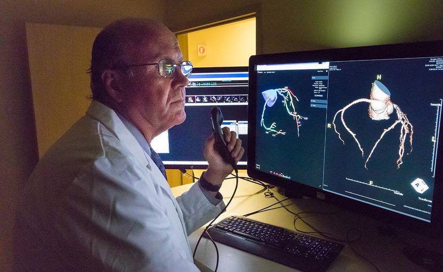 Scripps Clinic cardiologist George Wesbey III, MD,  reviews the results of a patient's diagnostic tests for heart disease.