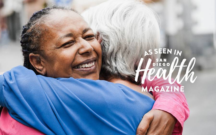 Two women hug who are united via organ donation. San Diego Health Magazine