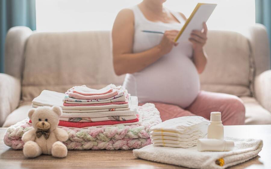 An expectant mother planning a nesting party before her baby arrives.