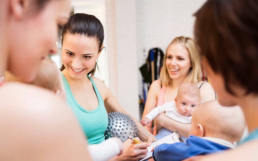 A group of mom and babies participate in an exercise class designed to strengthen mom's pelvic floor after childbirth.