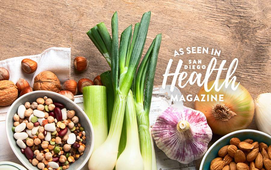 Foods pictured include almonds, walnuts, onions, chickpeas and white beans.