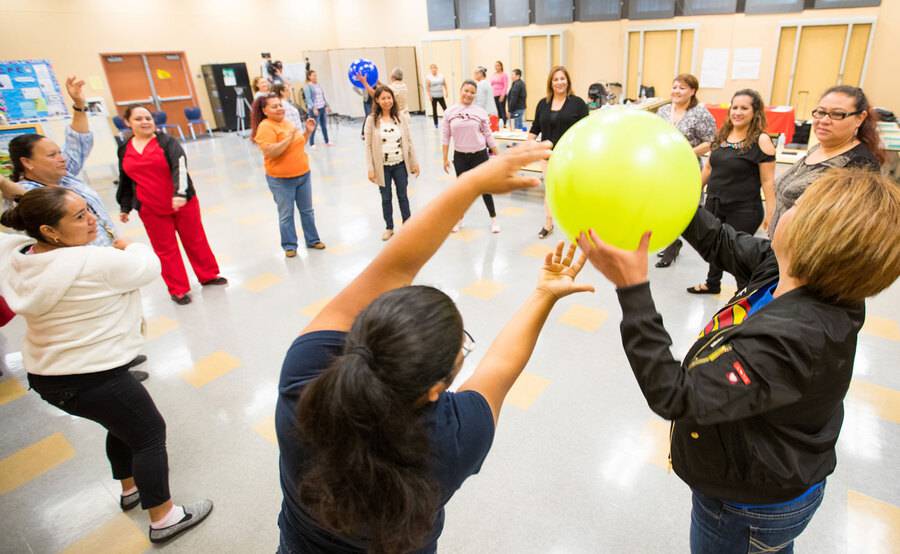 Project Dulce diabetes health educators learn activities together illustrating how to manage diabetes through movement.