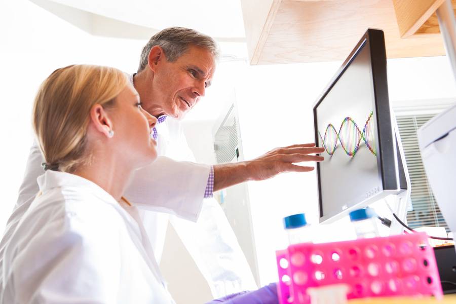 Research track mentor Eric Topol, MD, works with a trainee