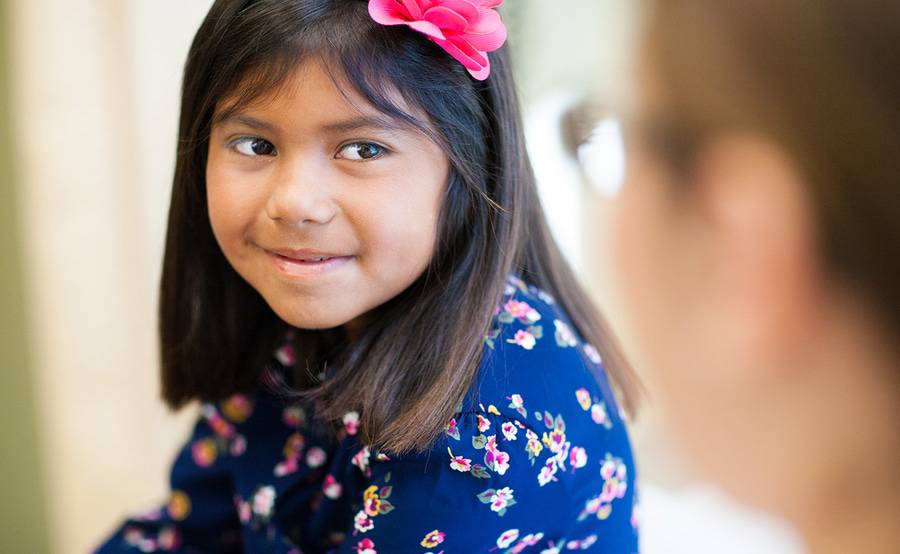 A nurse practitioner talks with a young patient at Scripps HealthExpress, a walk-in clinic offering care for minor injuries and illnesses for patients 5 and older.