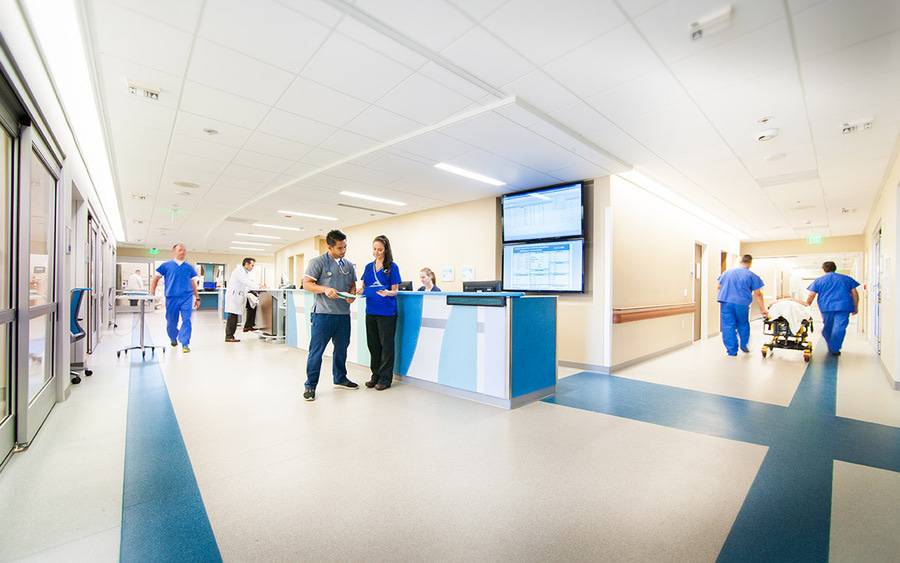 Two health care professionals discuss patient information, representing how Scripps compares to other hospitals.