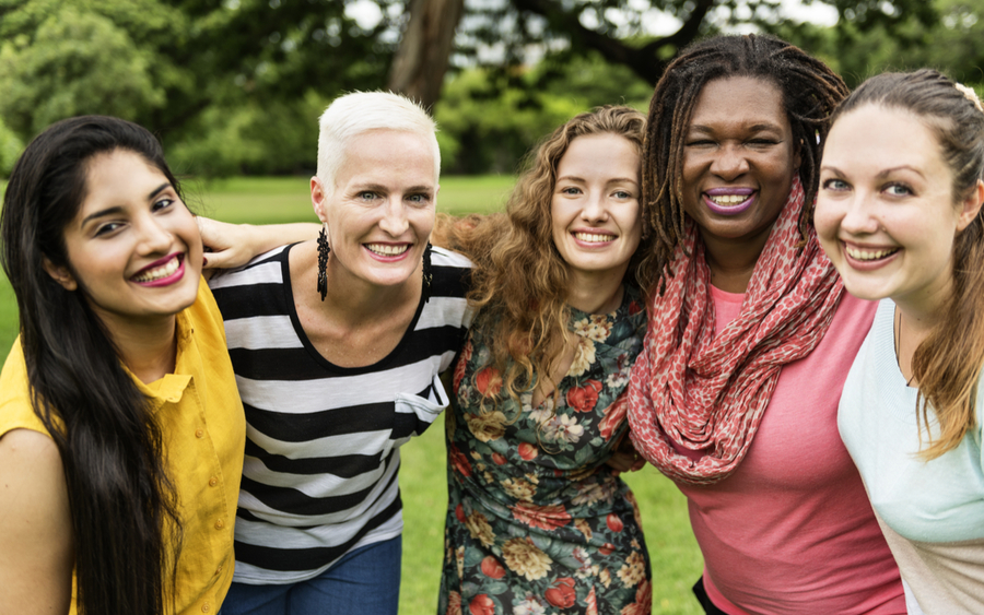 Five women linking arms