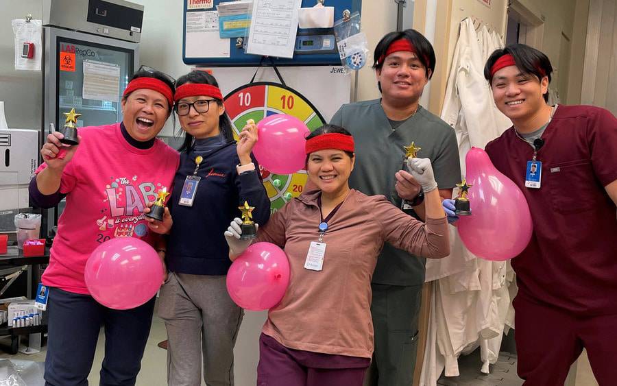 Scripps lab employees celebrate a team victory.